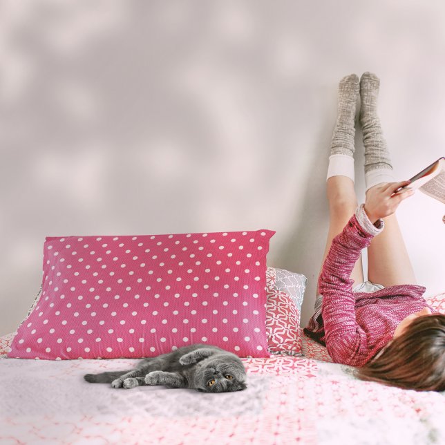 Dotty Delight Red Decorative Cushion (A girl is beside a Dotty Delight Red Accent Pillow on the bed.)