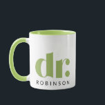 dr. [Custom Name] Mug<br><div class="desc">Celebrate professional achievements in style with this sleek and modern "dr." mug, featuring bold typography and a customisable name beneath. The sophisticated light green and white design, accented with a contrasting green interior and handle, makes it a perfect gift for doctors, PhDs, or anyone with a well-deserved title. Whether for...</div>