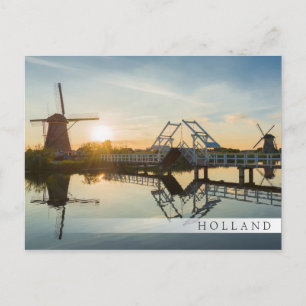 Drawbridge and windmills at sunset in Holland Postcard