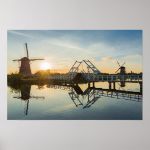 Drawbridge and windmills at sunset in Holland Poster
