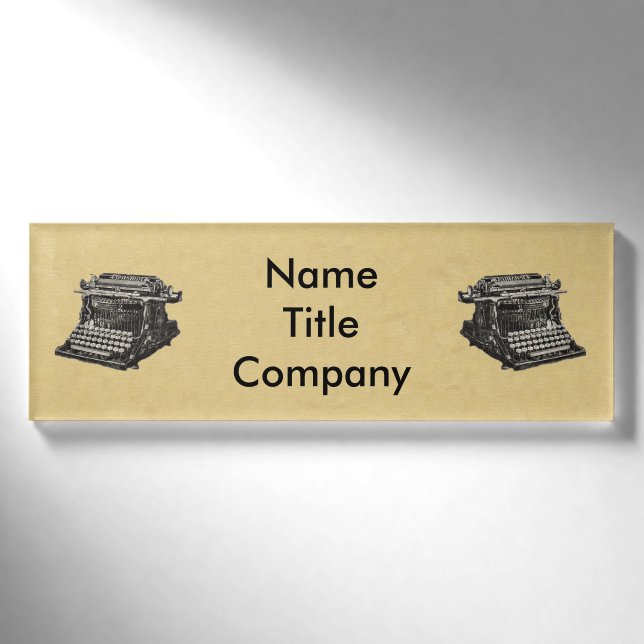 Drawing of black Old Time Typewriters on Tan Name Tag (Front)