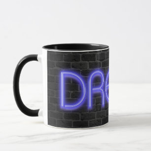 DREAM text in neon lights on brick Mug