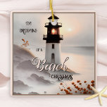 Dreaming of a Beach Christmas Ornament<br><div class="desc">Dreamy pink Christmas ornament featuring a painting of a lighthouse on the beach. A lighthouse is a symbol of hope and an indication of direction,  safety and thus a beautiful symbol for new beginnings.</div>