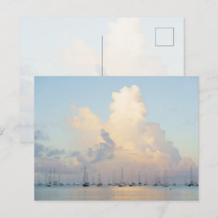 Dreamy pastel sunrise over bay and sailing boats postcard