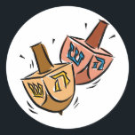 Dreidels Classic Round Sticker<br><div class="desc">two wooden dreidels on a design.</div>