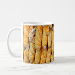 Dried corn that was stacked . coffee mug