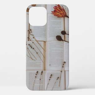 Dried flowers on books iPhone 12 case