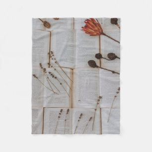 Dried flowers on books fleece blanket