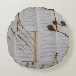 Dried flowers on books round cushion