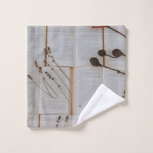 Dried flowers on books wash cloth