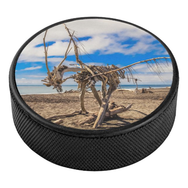 Driftwood artwork on Hokitika Beach, New Zealand Hockey Puck (3/4)