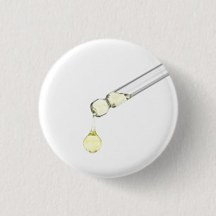 Dripping yellow serum from a pipette 3 cm round badge