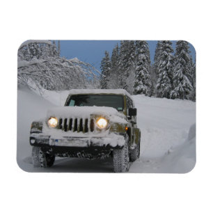 Driving on Snowy Road in Pine Forest Magnet
