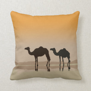 Dromedary camels and a mirage cushion
