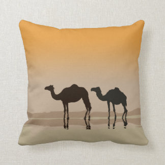 Dromedary camels and a mirage cushion