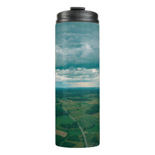 drone image. aerial view of rural area with houses thermal tumbler