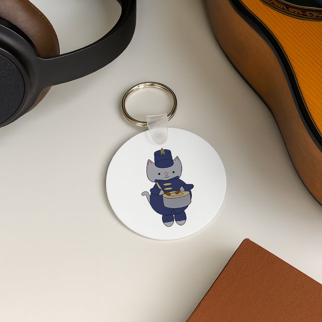 Drummer Cat Marching Band Navy Blue Gold Key Ring (A keychain with a snare drum playing cat in a navy blue and gold marching band uniform.)