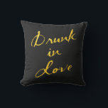 Drunk in Love Gold & Black Outdoor Pillow<br><div class="desc">This fun and flirty outdoor pillow is accented with the saying "Drunk in Love" in a bold gold brush stoke on a black background,  making it the perfect accessory for the couple's table at an outdoor wedding,  or the newlywed's deck,  patio or porch.</div>