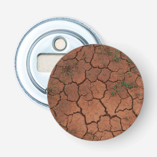dry, cracked ground bottle opener