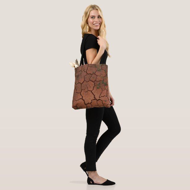 dry, cracked ground tote bag (On Model)