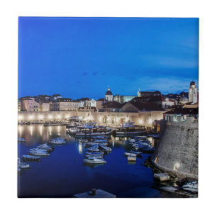 Dubrovnik harbor and walls illuminated at night ceramic tile