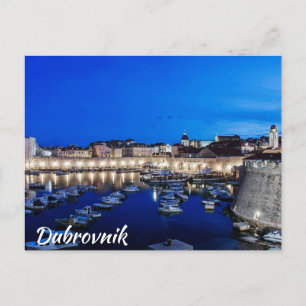 Dubrovnik harbor and walls illuminated at night postcard