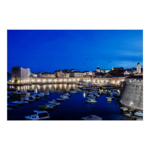 Dubrovnik harbor and walls illuminated at night poster