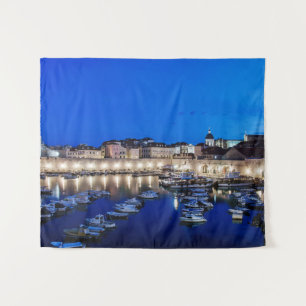 Dubrovnik harbor and walls illuminated at night tapestry