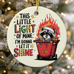 Dumpster Fire Racoon Monogram Christmas Ceramic Ornament<br><div class="desc">Add some light-hearted chaos to your holiday decor with this quirky Christmas ornament, featuring a mischievous racoon in a flaming dumpster with the phrase "This Little Light of Mine, I'm Gonna Let It Shine." Perfect for adding a dash of humour to the season, this ornament includes space for a monogram,...</div>