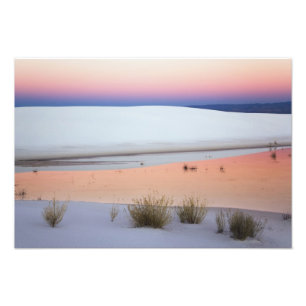 Dusk sky reflected in pool of water from photo print