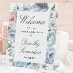 Dusty Blue Floral 100th Birthday Party Welcome Pedestal Sign<br><div class="desc">Welcome guests to your 100 th birthday party with this elegant dusty blue floral design. A lush arrangement of blue flowers is placed at the top. Welcome is written in a large trending font. The remainder of the text is a classic combination of an upright and italic font. Very easy...</div>