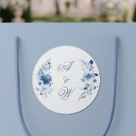 Dusty Blue Watercolor Floral Wedding Monogram Classic Round Sticker<br><div class="desc">Elegant dusty blue watercolor floral wedding monogram sticker featuring delicate botanical arrangements and a classic calligraphy monogram design. Perfect for sealing wedding invitations, decorating envelopes, favor boxes, welcome bags, and wedding stationery. This refined floral design is inspired by romantic garden weddings and timeless fine art wedding aesthetics. The soft dusty...</div>