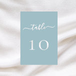 Dusty blue white script wedding table number card<br><div class="desc">A dusty blue background decorated.  White text.
  

Personalise and add your table numbers.  Add your numbers one by one.</div>