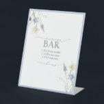 Dusty Blue Wildflower Bridal Shower Mimosa Bar Pedestal Sign<br><div class="desc">Set the tone for celebration with this refined Mimosa Bar sign—an understated nod to your hostess savvy. Featuring signature Blossom & Bliss typography and a whisper of wildflower detailing, it blends seamlessly into a curated drink station while guiding guests with elegant clarity. Perfect for brunch showers, morning-after breakfasts, or any...</div>