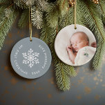 Dusty Blue Winter Snowflake First Christmas Photo Ceramic Ornament<br><div class="desc">Ceramic holiday ornament personalised with your baby's photo and custom "My First Christmas" text. This simple modern holiday design features a white snowflake on a dusty blue background. Use the design tools to choose any background colour, edit text fonts and colours and add your own photos to create your own...</div>