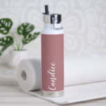 Dusty Rose Personalised Wedding Bridesmaid Water Bottle<br><div class="desc">Gift your wedding bridesmaid or maid of honour with this trendy, vacuum Insulated water bottle that features her name in white, stylised script on a dusty rose colour background designed to match your wedding colour scheme. Personalise bottle by editing and replacing name with your own as desired. Select your water...</div>