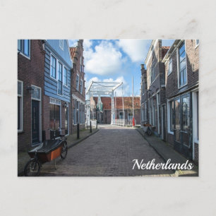 Dutch village with traditional wooden bridge postcard