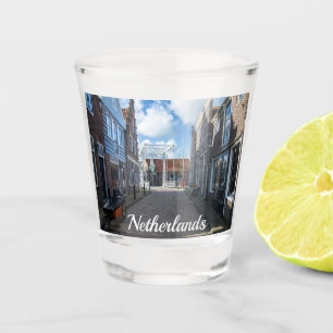 Dutch village with traditional wooden bridge shot glass