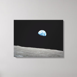 Earth Rising Above The Lunar Horizon. Canvas Print