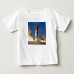 Earth Shakes as Saturn V Blazes Skyward to Moon Baby T-Shirt
