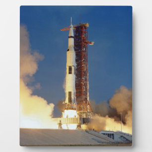 Earth Shakes as Saturn V Blazes Skyward to Moon Plaque
