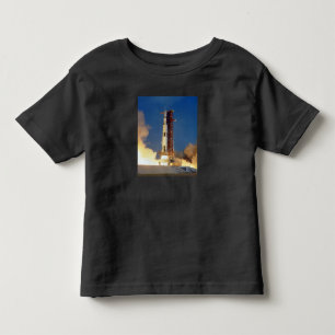 Earth Shakes as Saturn V Blazes Skyward to Moon Toddler T-Shirt