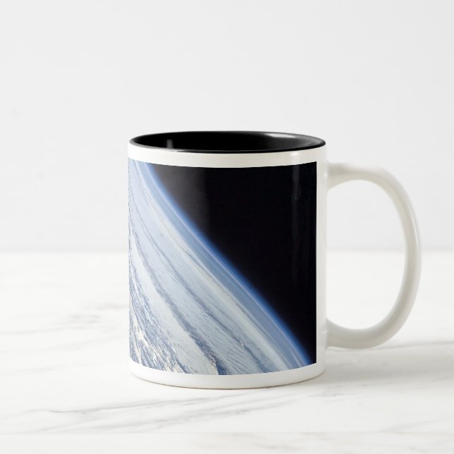 Earth's horizon against the blackness of space Two-Tone coffee mug (Right)