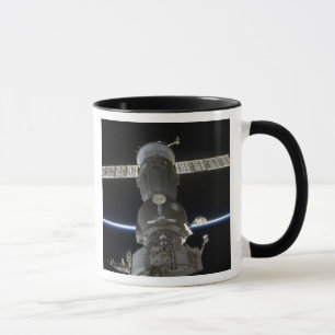 Earth's limb intersects a Soyuz spacecraft Mug