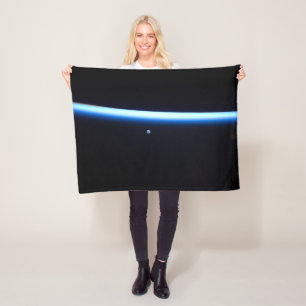 Earth's Thin Line Of Atmosphere And A Gibbous Moon Fleece Blanket