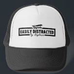 Easily Distracted By Aeroplanes, Funny Pilot Sayin Trucker Hat<br><div class="desc">Are you looking for funny Pilot Slogan Saying design vintage? so this humour saying joke "Easily Distracted By Aeroplanes" for any pilot who loves aviation, aeroplanes, helicopters. perfect! It's great for your spouse, husband, wife, or children who love aviation! Fathers Day, Christmas, and for men and women working in training...</div>