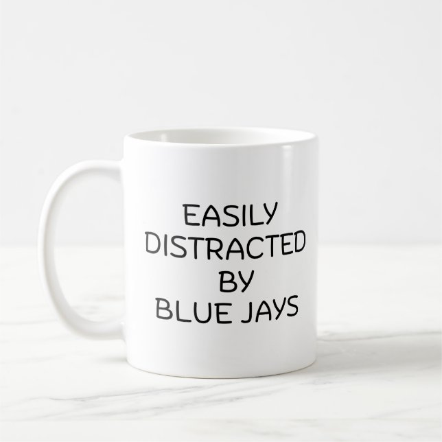easily distracted  by blue jays coffee mug (Left)