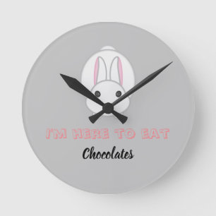 Easter bunny waiting to eat chocolates          round clock