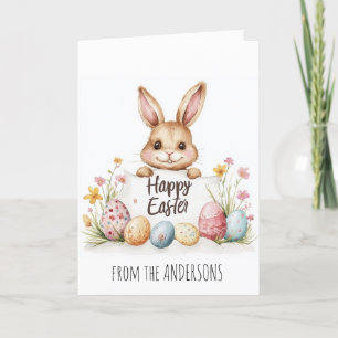 Easter eggs and cute bunny in background holiday card