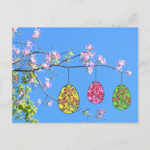 Easter eggs on a thriving branch holiday postcard